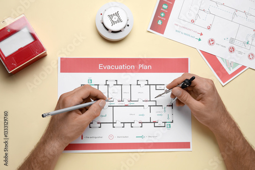 Man with smoke detector and...