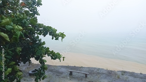 gloomy and cloudy beach view. The sea water looks murky and light brown