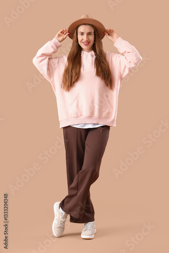 Stylish young woman in pink...