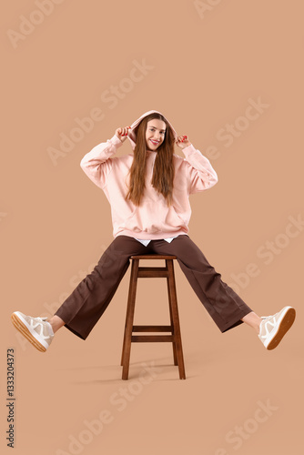 Stylish young woman in pink...