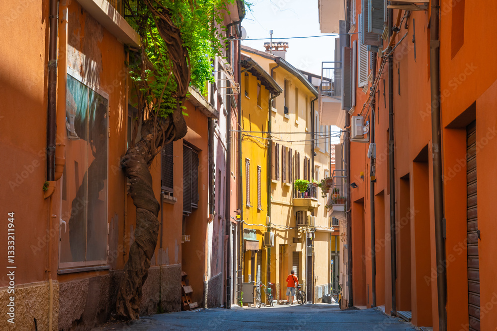 Beautiful narrow street with colorful houses in Rimini, Italy