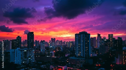 Wallpaper Mural Colorful sunset illuminates the skyline of a bustling urban city filled with skyscrapers and vibrant lights in the evening Torontodigital.ca