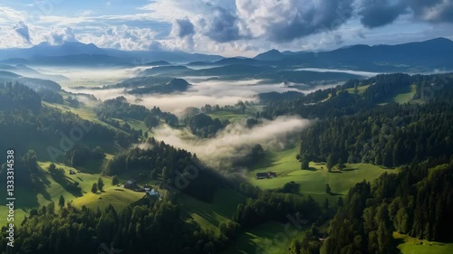 Expansive green hills and misty valleys reveal nature's beauty during early morning in the mountains