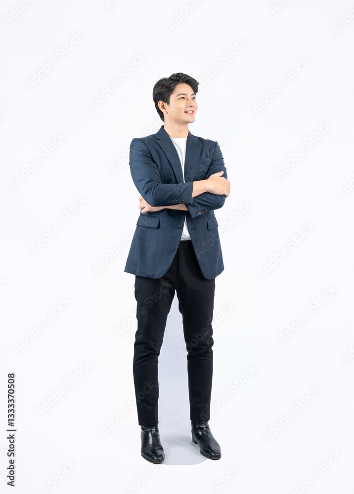 Full body image of a young Asian business man posing on a white background Full body image of a young Asian business man posing on a white background