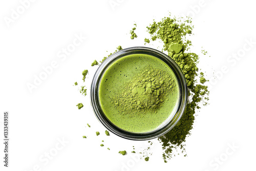 A vibrant green maccha powder in a glass bowl with some scattered around creating a fresh and healthy visual effect
