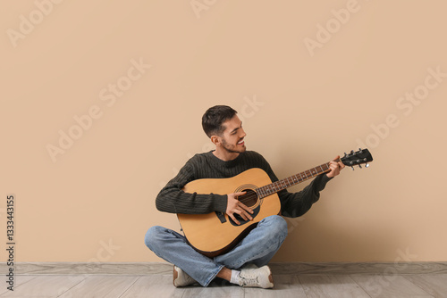 Handsome young man playing ...