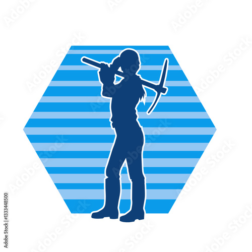 Silhouette of a construction worker in action with a pick axe tool. Silhouette of a miner labour in heavy duty work.