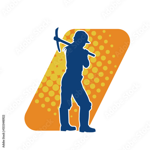 Silhouette of a construction worker in action with a pick axe tool. Silhouette of a miner labour in heavy duty work.