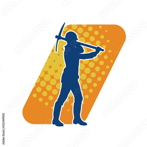 Silhouette of a construction worker in action with a pick axe tool. Silhouette of a miner labour in heavy duty work.