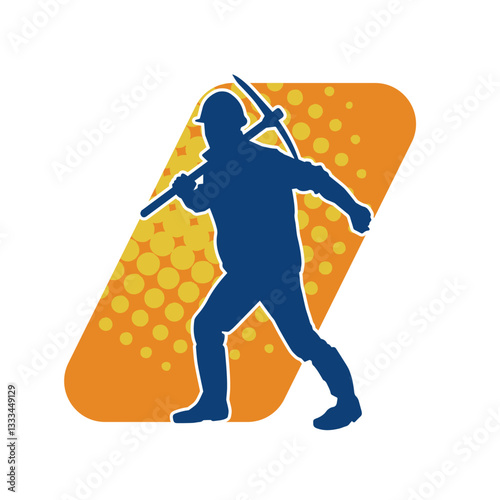 Silhouette of a construction worker in action with a pick axe tool. Silhouette of a miner labour in heavy duty work.