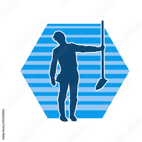 Silhouette of a worker carrying shovel tool. Silhouette of a worker in action pose using shovel tool.