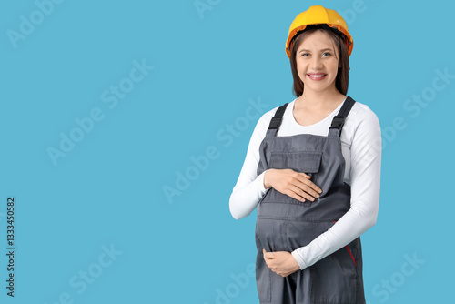 Young pregnant architect on...