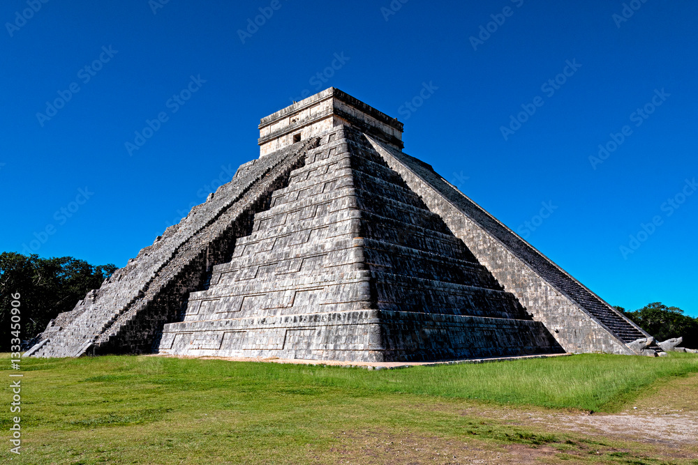 The iconic pyramid of Chichen Itza stands tall against a vibrant blue sky, reflecting ancient Mayan architecture and rich cultural heritage in a lush green environment. The iconic pyramid of Chichen Itza stands tall against a vibrant blue sky, reflecting ancient Mayan architecture and rich cultural heritage in a lush green environment.