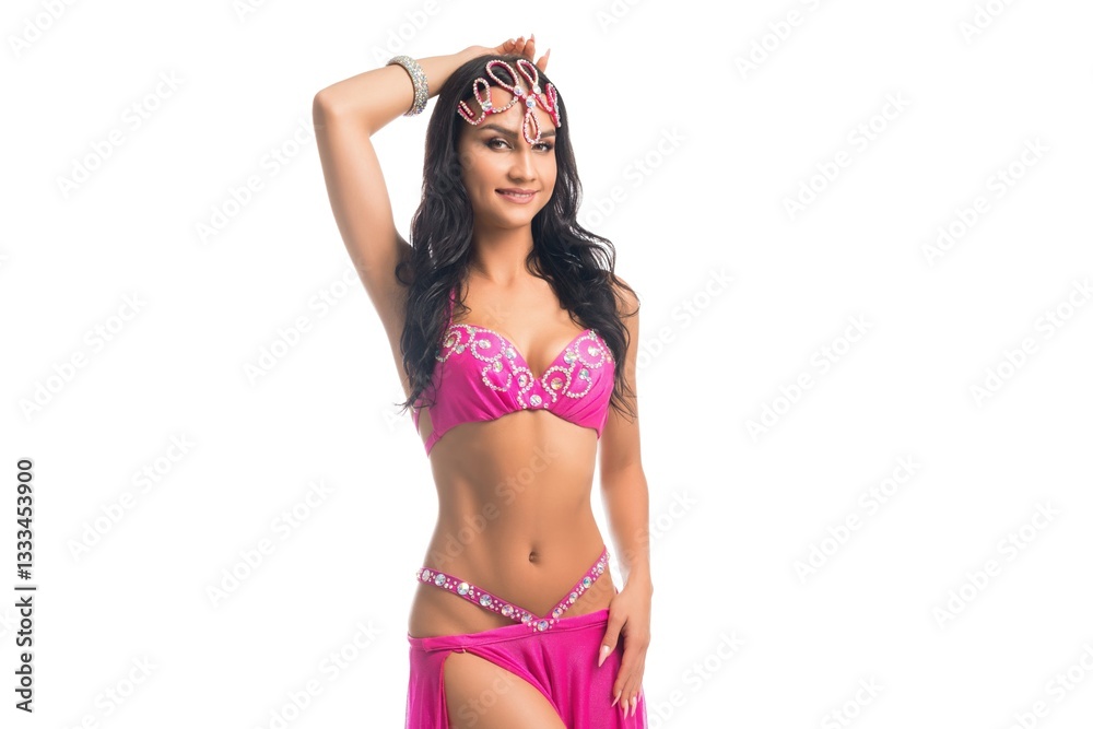 Elegant dancer showcasing traditional attire in vibrant performance pose Elegant dancer showcasing traditional attire in vibrant performance pose