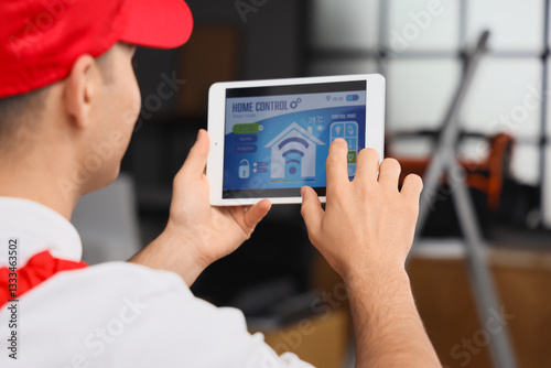 Male worker using tablet co...