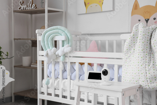 Baby monitor on stool near ...