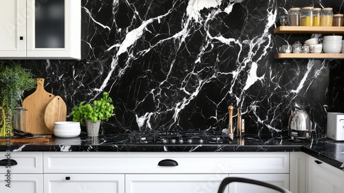 A kitchen interior featuring white and black marble walls, creating a sophisticated and modern aesthetic. photo
