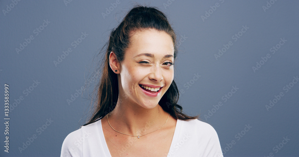 Wink, smile and portrait of woman in studio for secret, agreement and support gesture. Happiness, feedback and thank you with female person on background for review, rumor and well done sign Wink, smile and portrait of woman in studio for secret, agreement and support gesture. Happiness, feedback and thank you with female person on background for review, rumor and well done sign