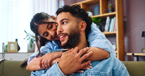 Home, hug and couple on sofa, love and bonding together with weekend break in lounge. Embrace, apartment and man with woman, calm and relax with romance, relationship and happiness with marriage
