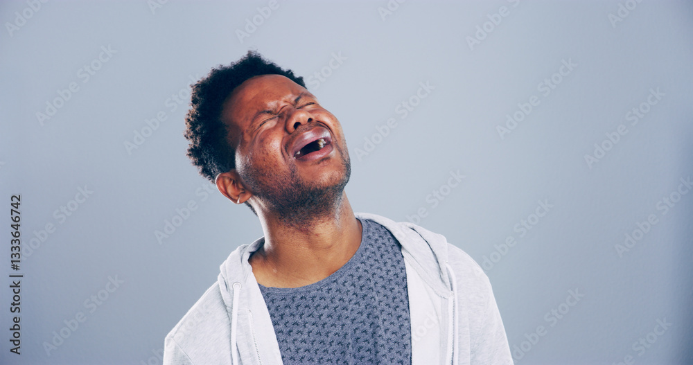 Obraz premium Grief, man and sad with crying in studio for broken heart, emotional and mourning loss. Mockup, black person and unhappy on gray background with sorrow, depression and pain from trauma or bad news