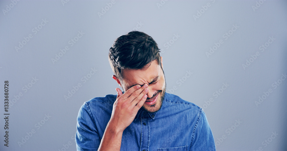 Sad, man and crying with emotions in studio for mourning loss, broken heart and bad news. Person, mockup space and grief with depression, mental health and ptsd with trauma memory on gray background Sad, man and crying with emotions in studio for mourning loss, broken heart and bad news. Person, mockup space and grief with depression, mental health and ptsd with trauma memory on gray background