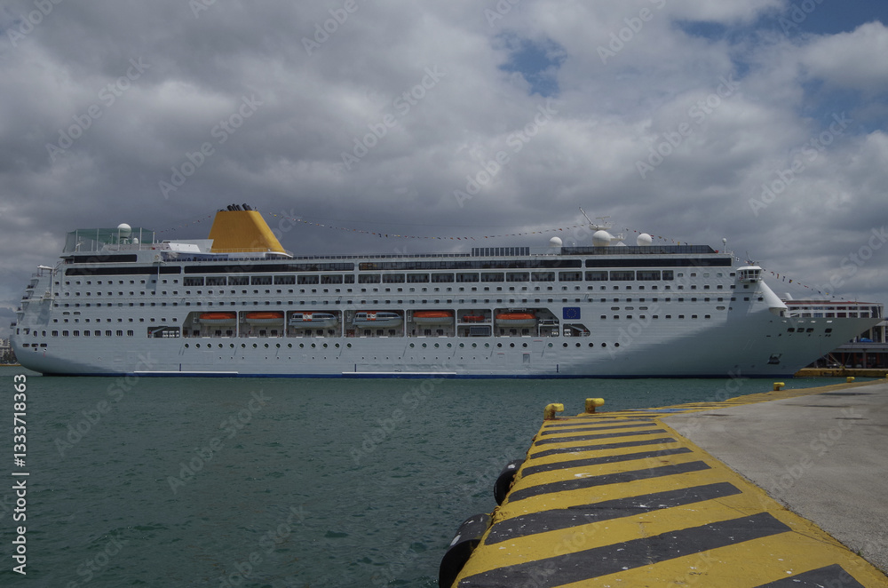 Classic cruiseship or cruise ship liner Neo Riviera in Piraeus Athens, Greece port on sunny day blue sky during Mediterranean Aegean Greek islands summer cruising dream vacation
