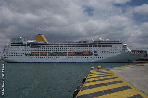 Obraz na płótnie Classic cruiseship or cruise ship liner Neo Riviera in Piraeus Athens, Greece port on sunny day blue sky during Mediterranean Aegean Greek islands summer cruising dream vacation w salonie