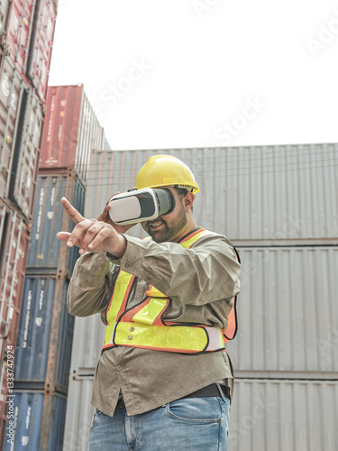 Male engineer wearing virtual reality headset to check quality of container handling system, control the placement and scheduling of shipments.