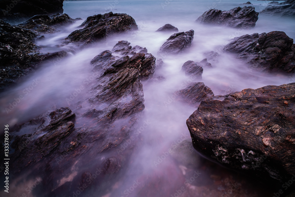 custom made wallpaper toronto digitalBeach rocks or stone with soft waves at sunset as a background.