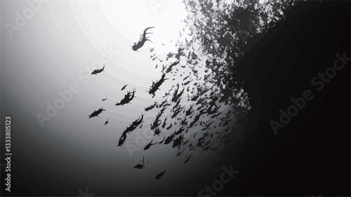 A high-contrast black and white image depicting a large school of fish silhouetted against a dark background.  The fish are clustered towards the right side of the frame, with a few individuals