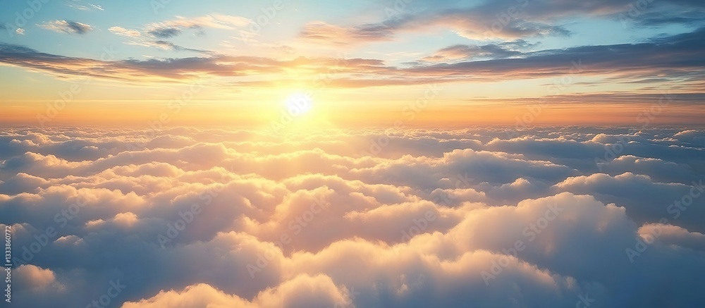Fototapeta premium A breathtaking view of the sky, with fluffy white clouds and a radiant sun setting in the background.