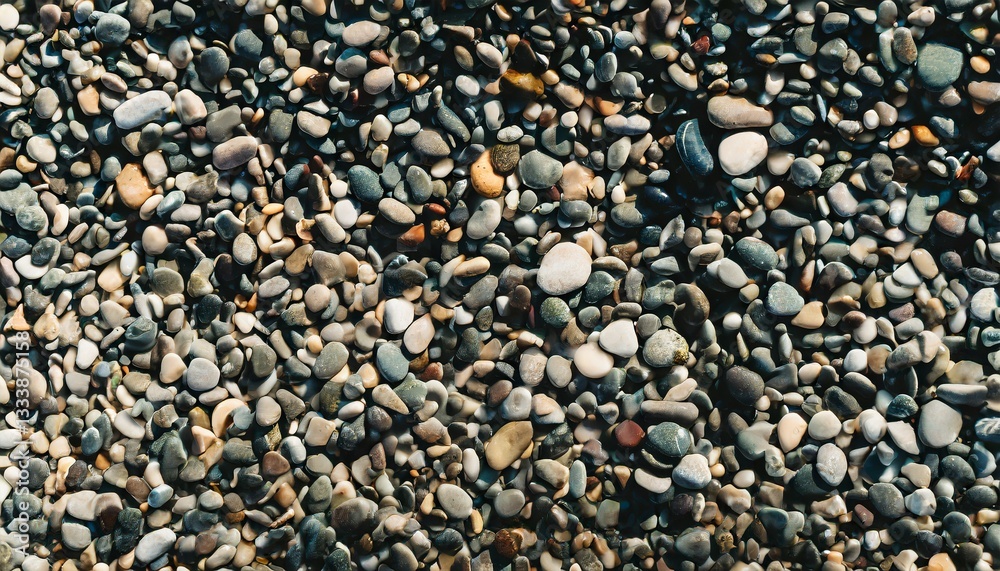 Colorful pebbles, sea stones and seashells on the beach bakcground texture, top view pattern Colorful pebbles, sea stones and seashells on the beach bakcground texture, top view pattern