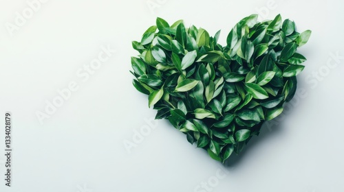 Heart Shape Created with Fresh Green Leaves on Light Background for Nature and Wellness Concepts