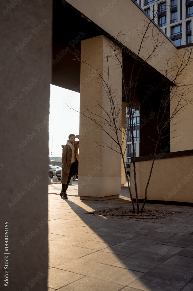 Fototapeta premium close-up portrait of a young guy. Stylish man in a coat. Portrait of a man 