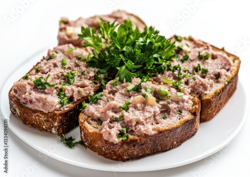 Savory meat spread sandwiches on plate,  fresh parsley garnish