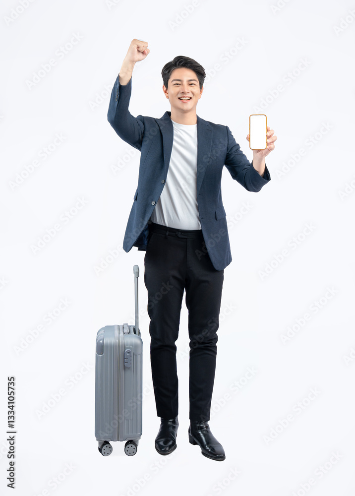 Full body image of young asian businessman pulling suitcase and using phone on white background Full body image of young asian businessman pulling suitcase and using phone on white background
