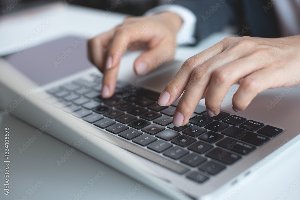 Close up, Business woman hand typing on laptop computer, working at office with digital tablet on office table. Woman searching the information, surfing the internet on laptop Close up, Business woman hand typing on laptop computer, working at office with digital tablet on office table. Woman searching the information, surfing the internet on laptop