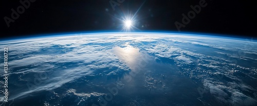 Obraz na płótnie Spectacular View of Earth from Space with Bright Sunlight Reflection w salonie
