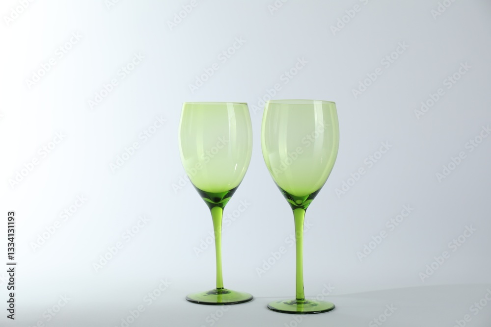Obraz premium Two empty clean glasses on light background