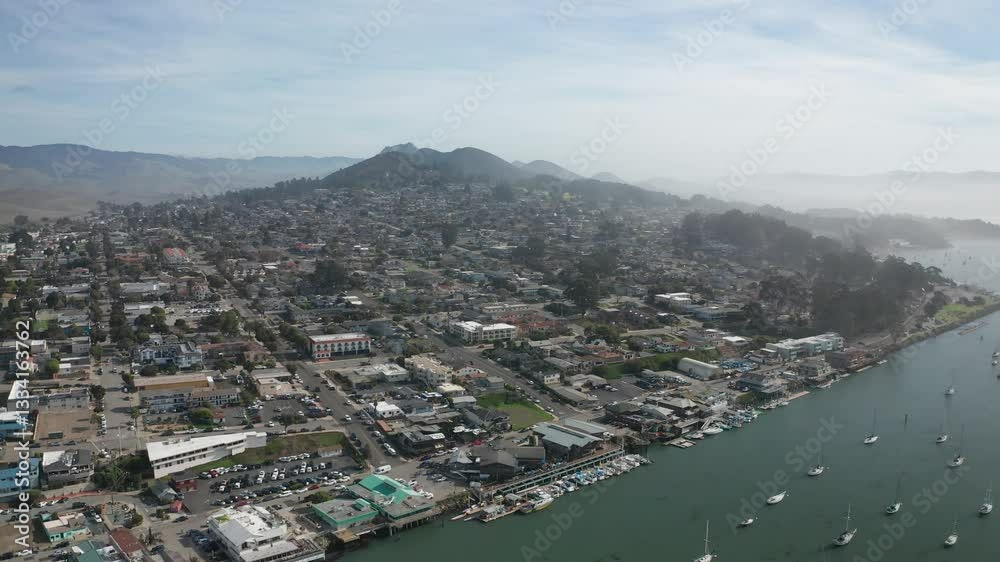 Wide aerial panning shot of Morro Bay, California. 4K