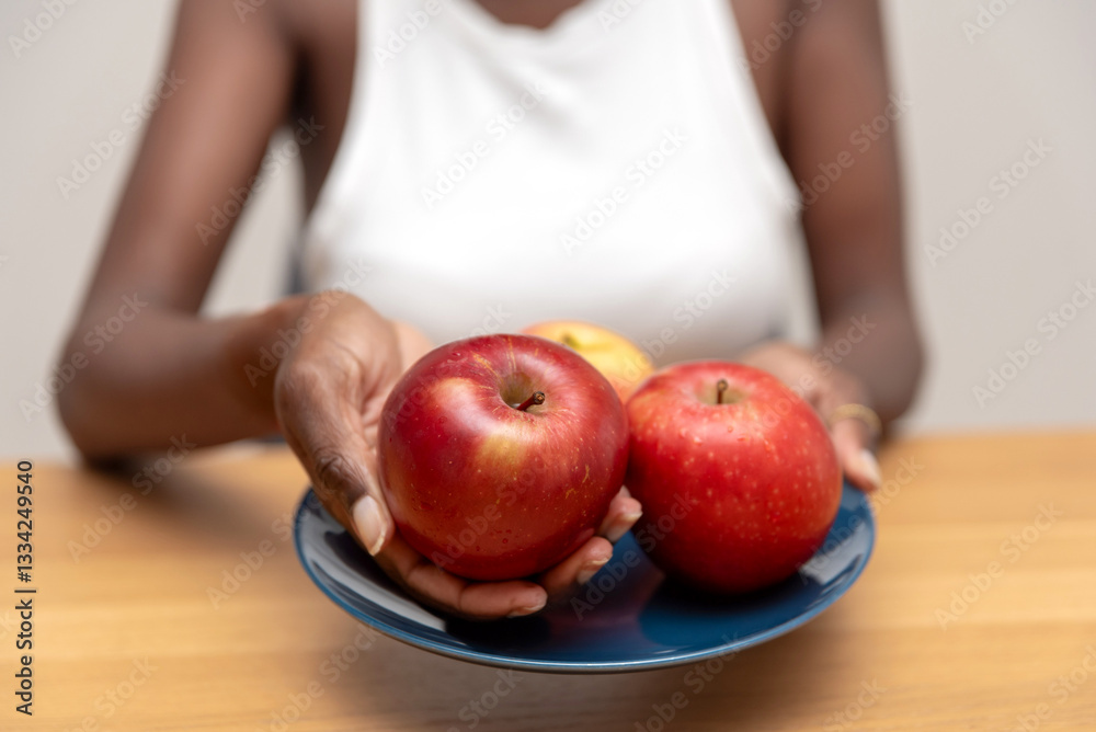 custom made wallpaper toronto digitalclose up of unrecognizable Woman Holding a Blue Plate with Red Apples on a Wooden Table
