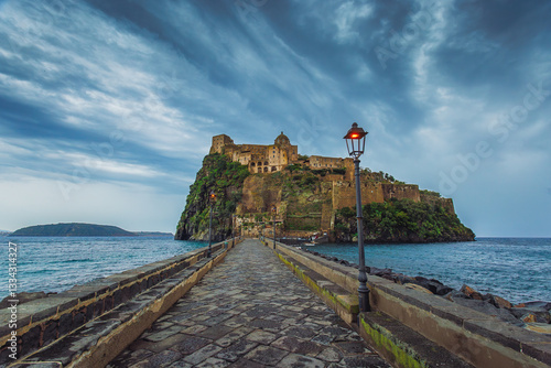 Ischia, Italy with Aragonese Castle in the Mediterranean at dusk