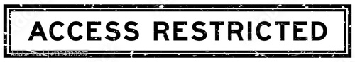 Grunge black access restricted word square rubber seal stamp on white bacckground