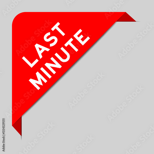 Red color of corner label banner with word last minute on gray background