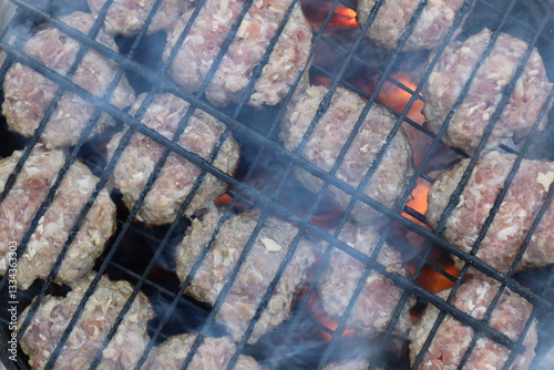 Turkish Food Kofte or Kofta. Turkish style meatball barbecue, mangal. Grilled meatballs with smoke.  photo
