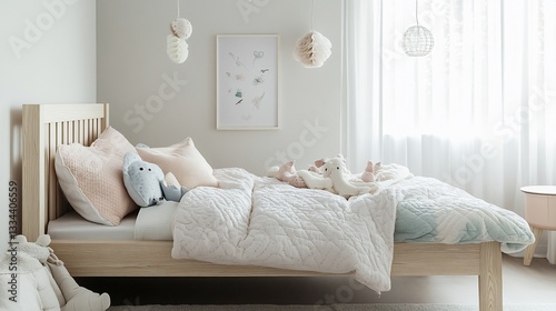 A cozy kids bedroom with a wooden bed, soft pillows and several plush toys awaiting a child