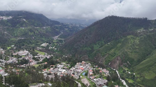 Aerial footage of the city Quito in Ecuador with the Volcan mountain on background