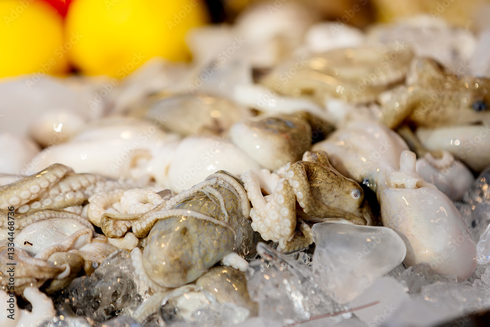 Close-up of fresh and chilled seafood displayed on store shelves. Concept of seafood, grocery shopping and healthy eating. Close-up of fresh and chilled seafood displayed on store shelves. Concept of seafood, grocery shopping and healthy eating.