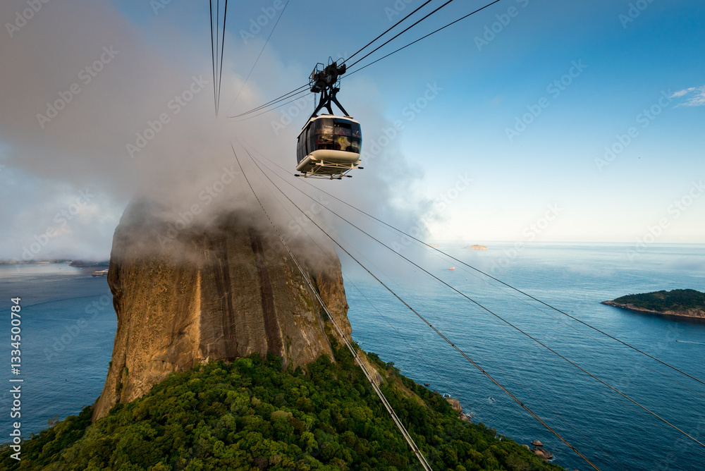 Fototapeta premium Sugarloaf Mountain Under Cloud with the Cable Car in Rio de Janeiro, Brazil