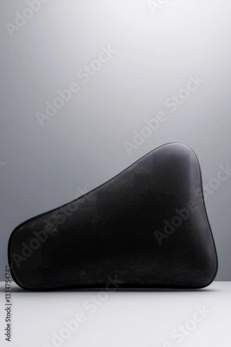 Ergonomic Memory Foam Travel Pillow in Dark Fabric Texture Perfect for Comfortable Journeys Isolated on White Background